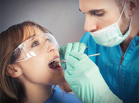 simsearch:640-02771694,k - Dentist effects a cleaning of the teeth Foto de stock - Super Valor sin royalties y Suscripción, Código: 400-08254171