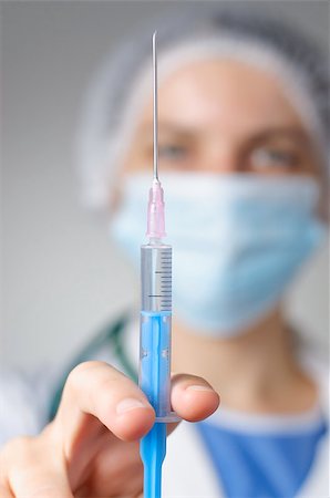 Closeup of a female doctor with syringe Stock Photo - Budget Royalty-Free & Subscription, Code: 400-08254182