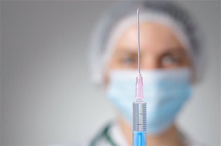 Closeup of a female doctor with syringe Stock Photo - Budget Royalty-Free & Subscription, Code: 400-08254293