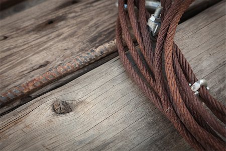 rebañar - Abstract Rusty Aged Iron Cable Laying on Old Wood Planks. Stock Photo - Budget Royalty-Free & Subscription, Code: 400-08254330