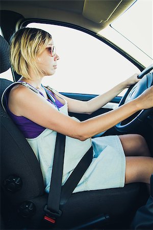 Pregnant woman wear safety belt in the car Stock Photo - Budget Royalty-Free & Subscription, Code: 400-08254403