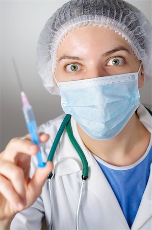 Closeup of a female doctor with syringe Stock Photo - Budget Royalty-Free & Subscription, Code: 400-08254425