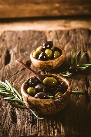 simsearch:400-05666507,k - olives on olive branch. Wooden table with olives in bowl Stock Photo - Budget Royalty-Free & Subscription, Code: 400-08254547