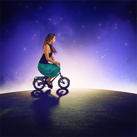 dreamy starry night - Girl with bike ride under the stars Stock Photo - Budget Royalty-Free & Subscription, Code: 400-08254605