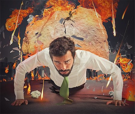 Businessman determined in city on fire destroyed Stock Photo - Budget Royalty-Free & Subscription, Code: 400-08254668