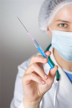 Closeup of a female doctor with syringe Stock Photo - Budget Royalty-Free & Subscription, Code: 400-08254781