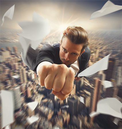 superhero business - Businessman flying over the city like superhero Foto de stock - Super Valor sin royalties y Suscripción, Código: 400-08255033