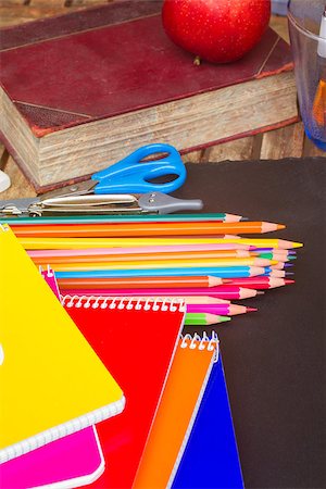 simsearch:400-07041220,k - Set of colorful pencils with book and notebooks on black board Stock Photo - Budget Royalty-Free & Subscription, Code: 400-08255102