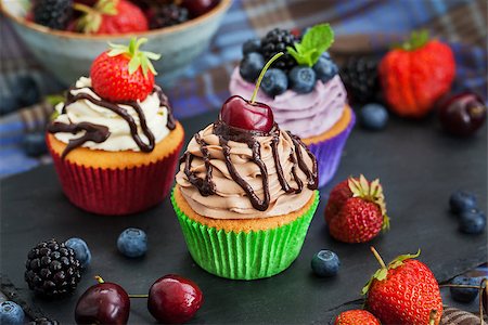 Set of different delicious cupcakes on dark Stock Photo - Budget Royalty-Free & Subscription, Code: 400-08255167