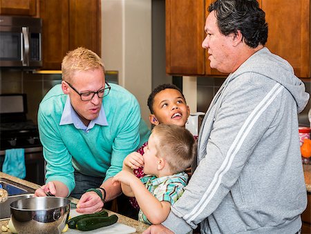 Preparing a meal with gay couple and kids in their home kitchen Stock Photo - Budget Royalty-Free & Subscription, Code: 400-08255176