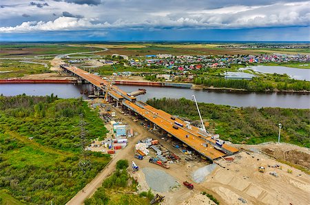 Tyumen, Russia - August 29, 2015: Construction of East Round bridge through Tura River Stock Photo - Budget Royalty-Free & Subscription, Code: 400-08255554