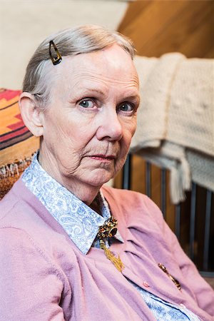 sad grandmother - Retro style old woman seated and looking at camera Stock Photo - Budget Royalty-Free & Subscription, Code: 400-08255836