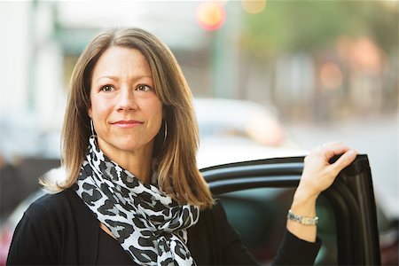 Confident European business woman standing near car door Stock Photo - Budget Royalty-Free & Subscription, Code: 400-08255833