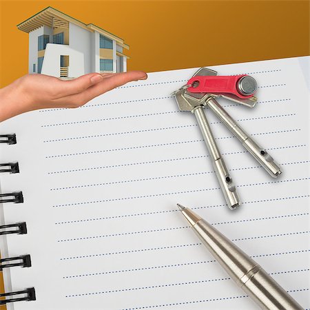 Humans hand holding house with keys and notebook Stock Photo - Budget Royalty-Free & Subscription, Code: 400-08255965
