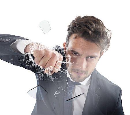 simsearch:400-04333650,k - Determined businessman breaks the glass with punch Stock Photo - Budget Royalty-Free & Subscription, Code: 400-08256192