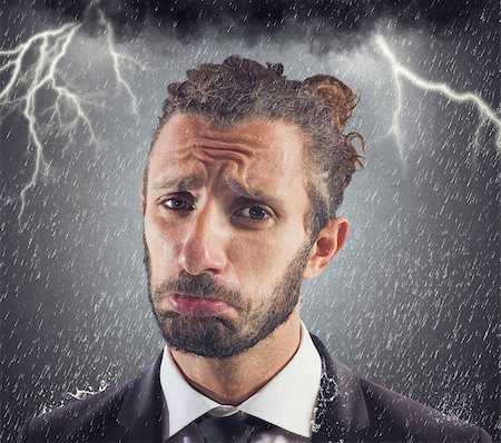 simsearch:400-08496169,k - Portrait of sad businessman with storm background Stock Photo - Budget Royalty-Free & Subscription, Code: 400-08256542