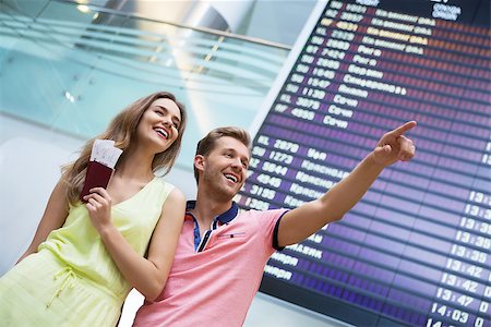 Attractive couple at board at the airport Stock Photo - Budget Royalty-Free & Subscription, Code: 400-08256680
