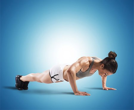 simsearch:400-08505882,k - Muscular woman is training doing push up Stock Photo - Budget Royalty-Free & Subscription, Code: 400-08256839