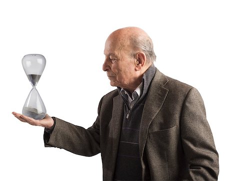 simsearch:400-05746567,k - Elderly man holds an hourglass in hand Stock Photo - Budget Royalty-Free & Subscription, Code: 400-08256844