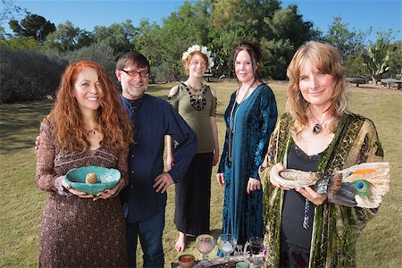 priest blessing - Five smiling Wicca practitioners standing outdoors with smudge stick Stock Photo - Budget Royalty-Free & Subscription, Code: 400-08257073