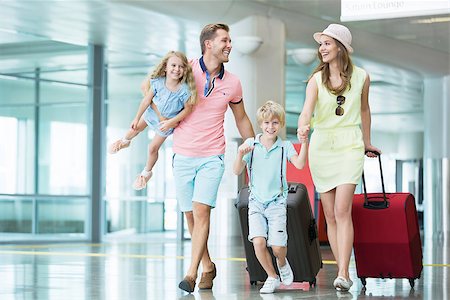 family and luggage summer - Smiling family with children at the airport Stock Photo - Budget Royalty-Free & Subscription, Code: 400-08257454