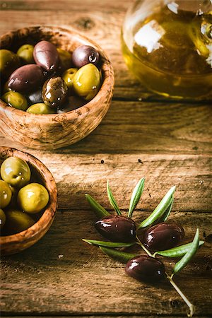 simsearch:400-05666507,k - olives on olive branch. Wooden table with olives and olive oil Stock Photo - Budget Royalty-Free & Subscription, Code: 400-08257683