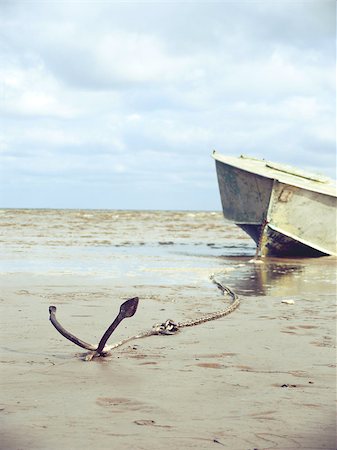 simsearch:400-06880871,k - anchored on the shore with boat in the background Stock Photo - Budget Royalty-Free & Subscription, Code: 400-08257756