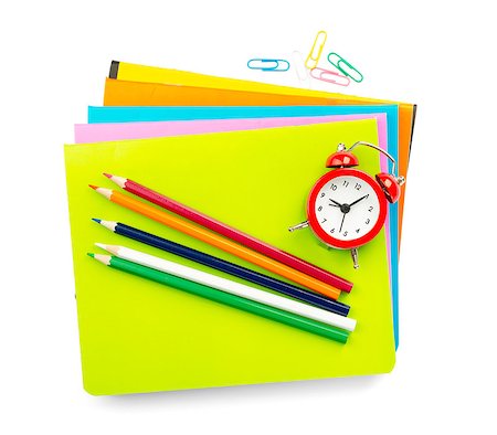 simsearch:400-04801462,k - Crayons with notebooks and alarm clock on isolated white background, front view Stock Photo - Budget Royalty-Free & Subscription, Code: 400-08258279