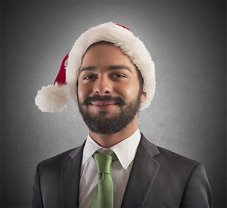 portrait picture adam and eve - Smiling businessman with hat of Santa Claus Stock Photo - Budget Royalty-Free & Subscription, Code: 400-08258894