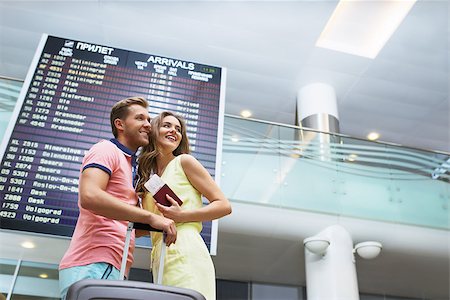 Smiling couple at the airport Stock Photo - Budget Royalty-Free & Subscription, Code: 400-08258988
