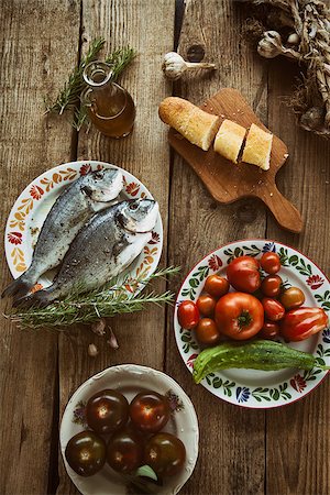 Healthy eating. Bream fish preparation. Seafood with vegetables Foto de stock - Super Valor sin royalties y Suscripción, Código: 400-08250223