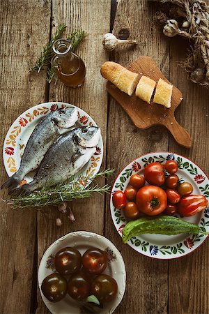 Healthy eating. Bream fish preparation. Seafood with vegetables Stockbilder - Microstock & Abonnement, Bildnummer: 400-08250223