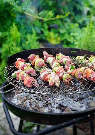 flame grilled chicken photography - Summer barbecue. Meat BBQ with herbs and vegetables. Outdoor grill food Stock Photo - Budget Royalty-Free & Subscription, Code: 400-08250300