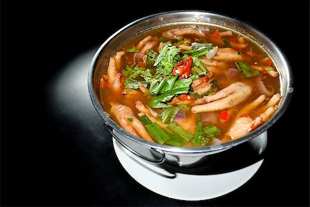 Spicy soup Chicken Foot in hot bowl and black background Stock Photo - Budget Royalty-Free & Subscription, Code: 400-08250335