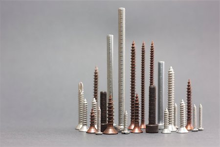 Set of screws on gray background Stock Photo - Budget Royalty-Free & Subscription, Code: 400-08250341