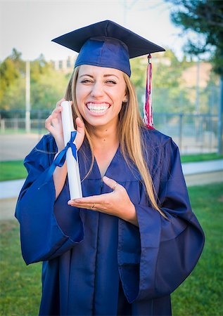 Excited and Expressive Young Woman Holding Diploma in Cap and Gown Outdoors. Stock Photo - Budget Royalty-Free & Subscription, Code: 400-08250443