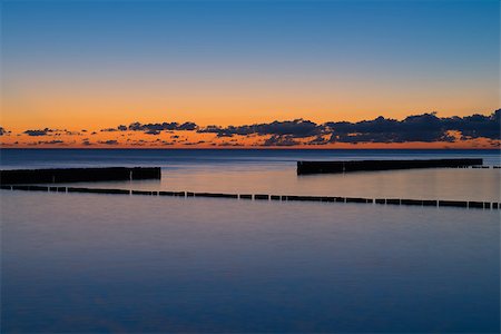 simsearch:400-05130866,k - Tranquil Coastal Sunset with old breakwater on the beach Stock Photo - Budget Royalty-Free & Subscription, Code: 400-08250637