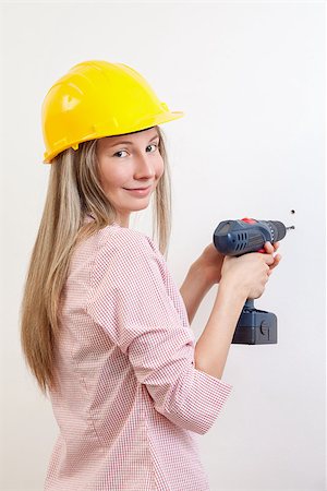 simsearch:400-05704666,k - Young woman doing the DIY work and wearing protective helmet Stock Photo - Budget Royalty-Free & Subscription, Code: 400-08250710