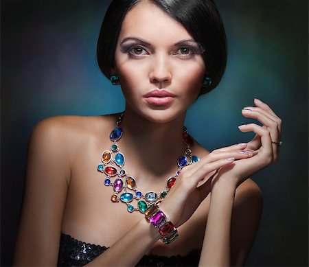 simsearch:400-06101469,k - portrait of a glamorous girl with black hair and an expensive necklace with precious and colored stones Stock Photo - Budget Royalty-Free & Subscription, Code: 400-08250829