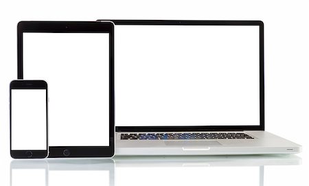 Modern laptop, smartphone, tablet pc on a white background Foto de stock - Super Valor sin royalties y Suscripción, Código: 400-08250955