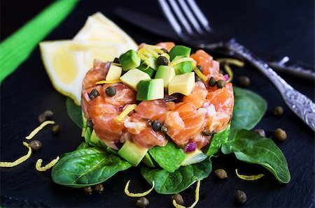 pickled lemon - Tasty salmon and avocado tartar, dark background Stock Photo - Budget Royalty-Free & Subscription, Code: 400-08251014