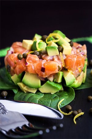 pickled lemon - Tasty salmon and avocado tartar, dark background Stock Photo - Budget Royalty-Free & Subscription, Code: 400-08251015