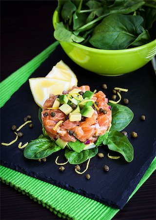 pickled lemon - Tasty salmon and avocado tartar, dark background Stock Photo - Budget Royalty-Free & Subscription, Code: 400-08251012
