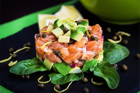 pickled lemon - Tasty salmon and avocado tartar, dark background Stock Photo - Budget Royalty-Free & Subscription, Code: 400-08251013