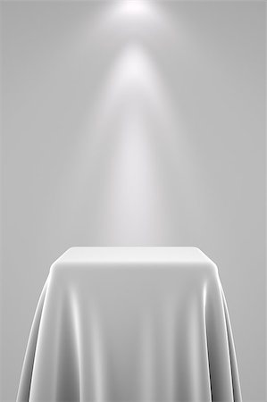 Presentation pedestal covered with a white silk cloth in front of a wall illuminated by a spot light Fotografie stock - Microstock e Abbonamento, Codice: 400-08251398