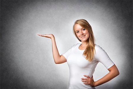 Blond woman presenting something, free space Stock Photo - Budget Royalty-Free & Subscription, Code: 400-08251468