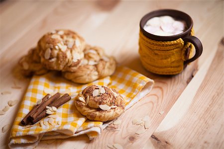 almond cookies with cup of cappucino on light wood table Stock Photo - Budget Royalty-Free & Subscription, Code: 400-08251522