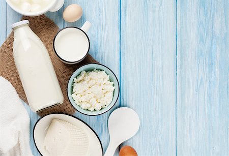 simsearch:400-08296754,k - Dairy products on wooden table. Sour cream, milk, cheese, eggs and yogurt. Top view with copy space Stock Photo - Budget Royalty-Free & Subscription, Code: 400-08251577
