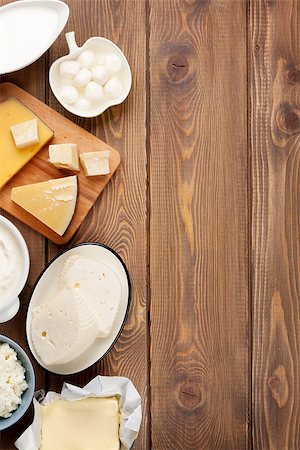 simsearch:400-07825089,k - Dairy products on wooden table. Sour cream, milk, cheese, yogurt and butter. Top view with copy space Stockbilder - Microstock & Abonnement, Bildnummer: 400-08251579