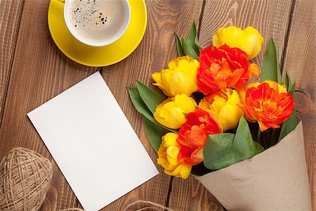 simsearch:400-08298802,k - Colorful tulips bouquet, blank greeting card and coffee cup on wooden table Photographie de stock - Aubaine LD & Abonnement, Code: 400-08251587